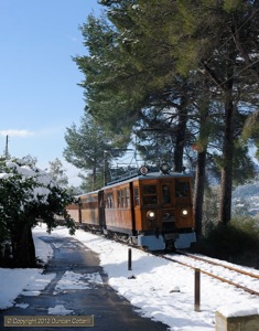 Snow is not unknown on Mallorca but the fall over the first weekend of February 2012 was the heaviest for more than half a century. Motor coach No.2 picked its way through the white stuff on the southern approach to Bunyola with the 10:50 from Palma to Soller on 5 February 2012.